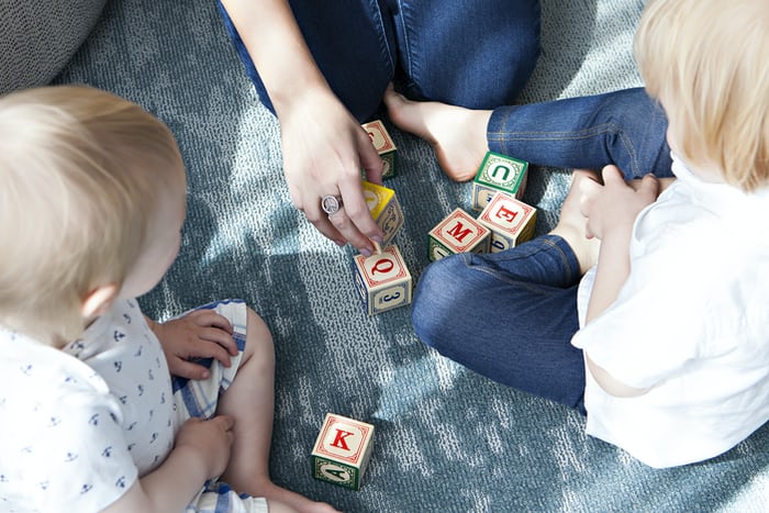 Children at daycare with a caretaker