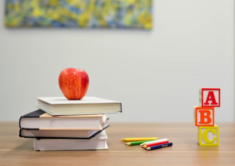 books with an apple on top